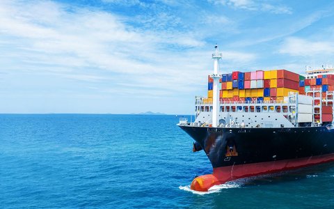 Fully loaded container ship on high seas