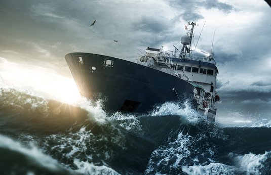 Ship in rough seas with high waves