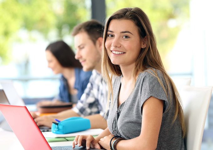 Three students in classroom