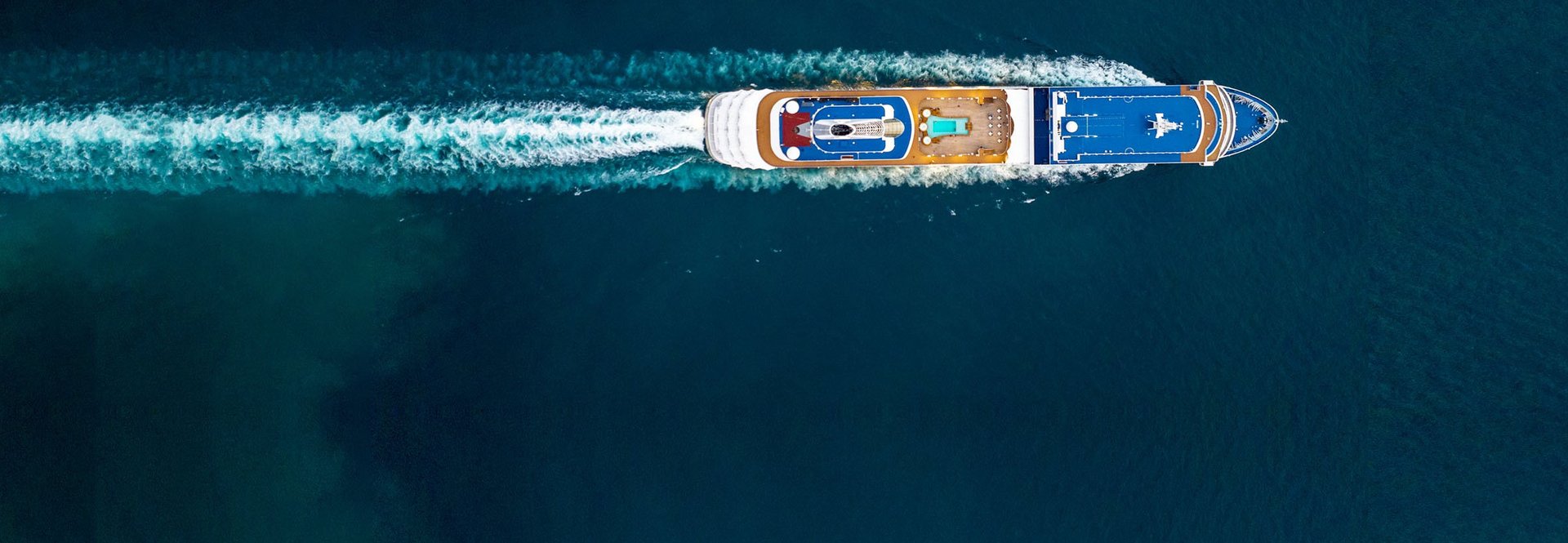 View from above of a cruise ship at full speed